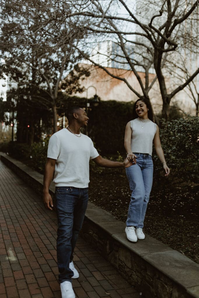 Couple Session at The Green in Charlotte NC | Couple walking on wall