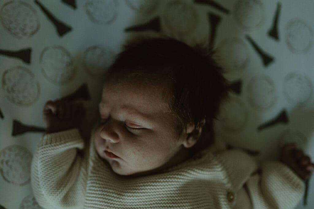 Baby lying in crib