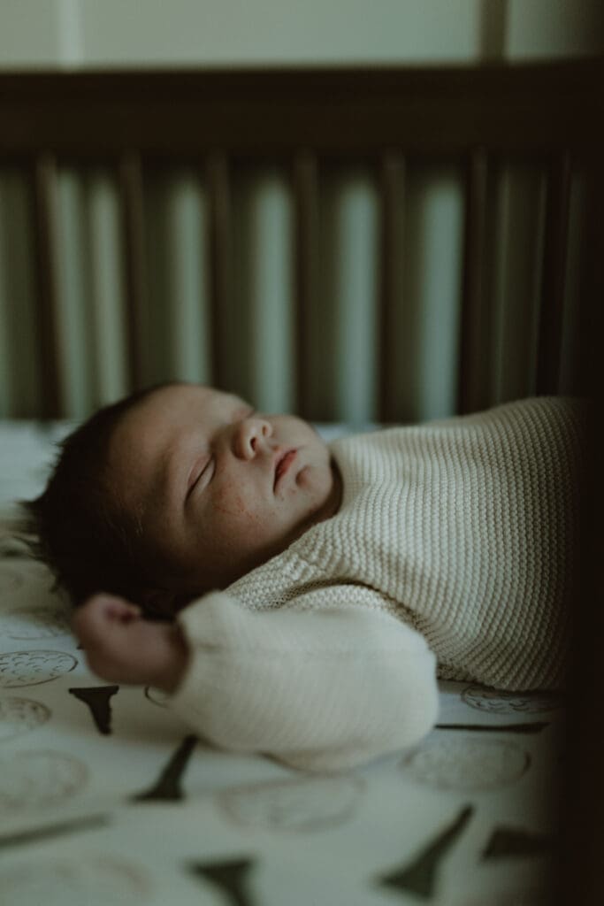 Baby lying in crib